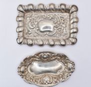 PAIR OF SILVER REPOUSSE BON BON DISHES.