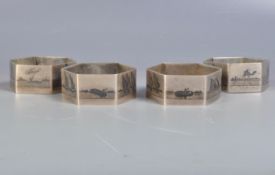 GROUP OF FOUR SILVER EGYPTIAN NIELLO NAPKIN RINGS.