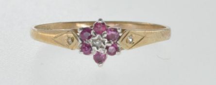 9CT GOLD RING SET WITH DIAMOND AND RED STONES.