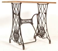MID 20TH CENTURY CAST IRON SINGER BASE GARDEN TABLE