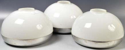 MANNER OF GUZZINI - SET OF THREE OPALINE GLASS AND CHROME SHADES.