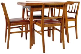 E. GOMME - G-PLAN GOLDEN OAK DINING TABLE AND FOUR CHAIRS