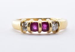 18CT GOLD RUBY AND DIAMOND FOUR STONE RING