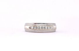 STAMPTED 14CT WHITE GOLD AND PAVE SET DIAMOND RING.