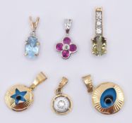 ASSORTMENT OF FIVE GOLD PENDANTS
