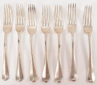 HARLEQUIN SET OF SEVEN SILVER FORKS