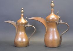 TWO COPPER AND BRASS PERSIAN DALLAH COFFEE POT