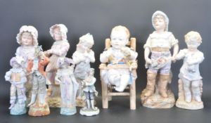 LARGE GROUP OF CONTINENTAL BISQUE CERAMIC FIGURINES
