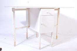 MID 20TH CENTURY RED FORMICA DROP LEAF KITCHEN TABLE