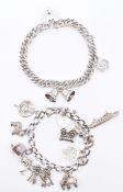 TWO VINTAGE SILVER CHARM BRACELETS