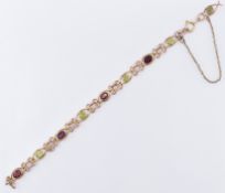 9CT GOLD PERIDOT & GARNET BRACELET