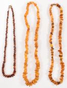 THREE AMBER BEADED NECKLACES
