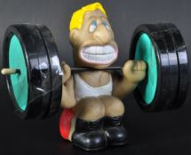 ESTATE OF DAVE PROWSE - COASTER WEIGHTLIFTING ORNAMENT FROM DAVE'S DESK