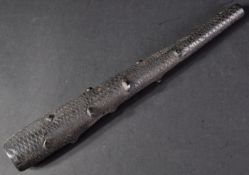 19TH CENTURY IRISH BOG OAK COSH / PERSUADER WITH CARVED DETAILING