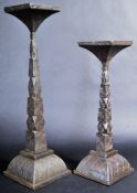 GRADUATING PAIR OF CAST IRON ECCLESIASTICAL CANDLE HOLDERS