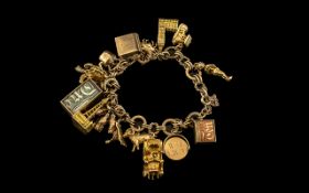 9ct Gold Vintage Charm Bracelet - Loaded with 16 9ct Gold Charms.