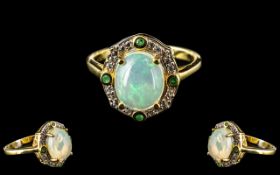 Opal and Emerald Halo Ring, a wonderfully domed cabochon cut opal of 2.