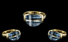 18ct Gold - Attractive and Good Quality Blue Topaz Set Dress Ring. The Blue Topaz of Contemporary