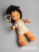An early felt covered souvenir tennis doll wearing tennis outfit and wielding a tennis racquet,