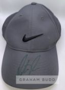 Patrick Reed (USA) signed Nike cap and action photo, cap his own sponsor and branding signed on peak