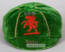 Green Wales International cap awarded in 1912, the green velvet cap with gilt braiding,
