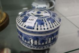 A Chinese blue and white circular porcelain box and cover.