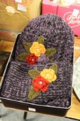 A ladies' woollen scarf and matching hat.