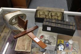A Victorian stereoscopic viewer with a box of viewing cards.