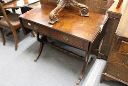 A reproduction burr wood sofa table.