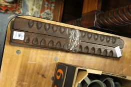 A group of carved wood chocolate moulds.