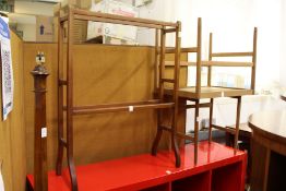 A standard lamp, a towel rail and two occasional tables.