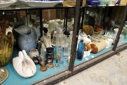 A large shelf of decorative china, glass etc.