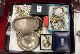 A quantity of costume jewellery and two small silver dishes.