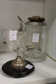 A small cut glass cornucopia vase on silver and ebonised stand and a continental glass tankard.