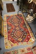 A Kilim flat weave rug.