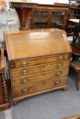 A George III oak bureau.
