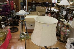 A large decorative lamp base and shade.