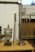 A glass and gilt metal vase and cover and a chrome candelabra.