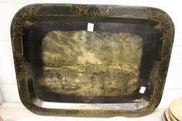 A 19th century Toleware rectangular tray decorated with a river scene with buildings and sailing