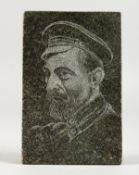 A Russian marble paperweight engraved with the bust of a military man.