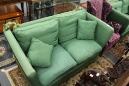 A good large two seater Knoll settee upholstered in a green watered silk style fabric.