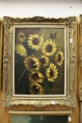 A study of sunflowers, oil on board, decoratively framed.