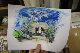 A small group of unframed posters.