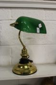 A brass desk lamp.