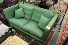 A good large two seater Knoll settee upholstered in a green watered silk style fabric.