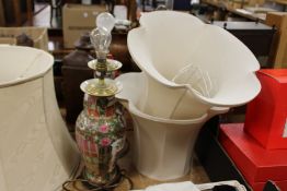 A pair of oriental lamps with shades.