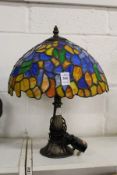 A small Tiffany style table lamp.