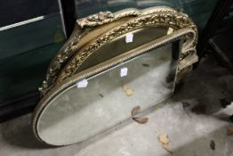 Three decorative gilt framed mirrors.