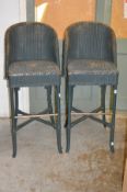 A pair of modern Lloyd Loom bar stools.