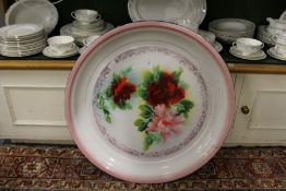 A large continental circular enamel dish.